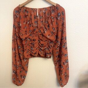 Free People Orange XS floral crop top with flowing sleeves.